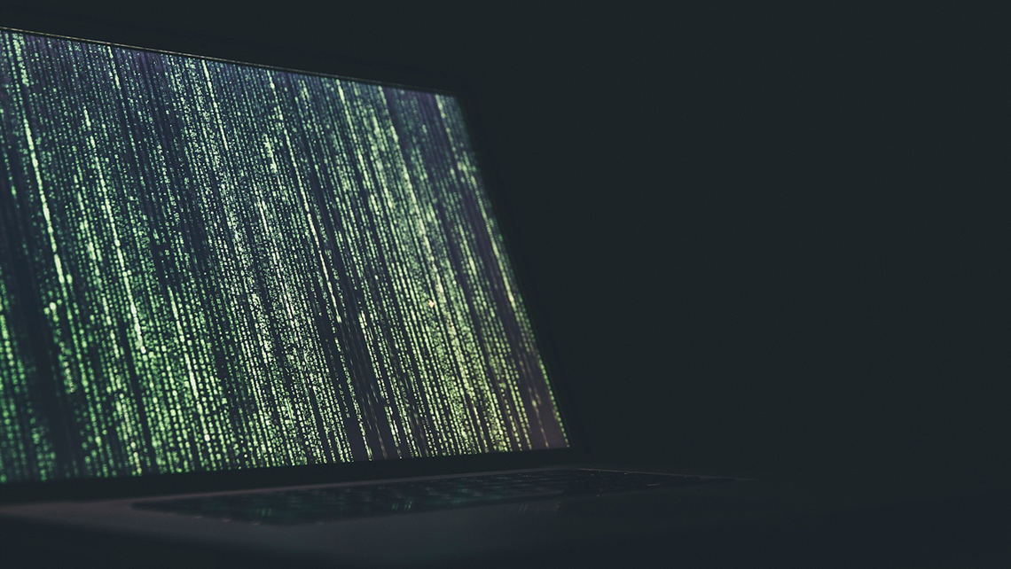 Laptop screen showing code.