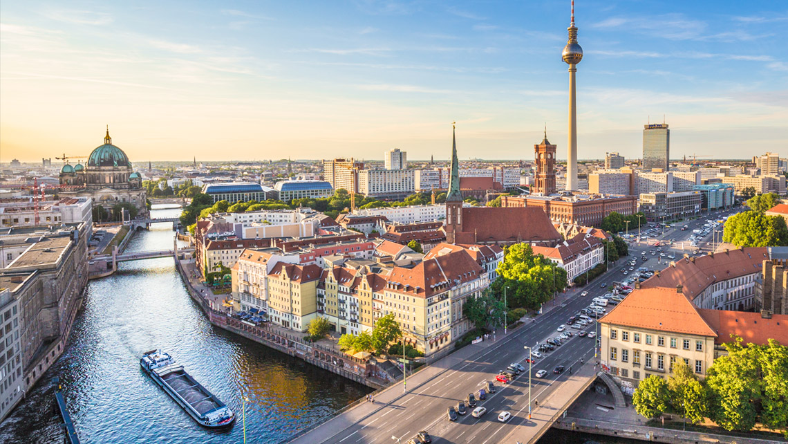 Berlin skyline with Spree river at sunset.