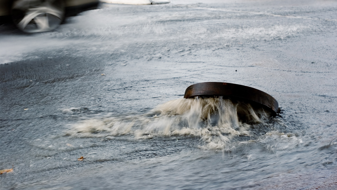 Open sewer in a flooded street.
