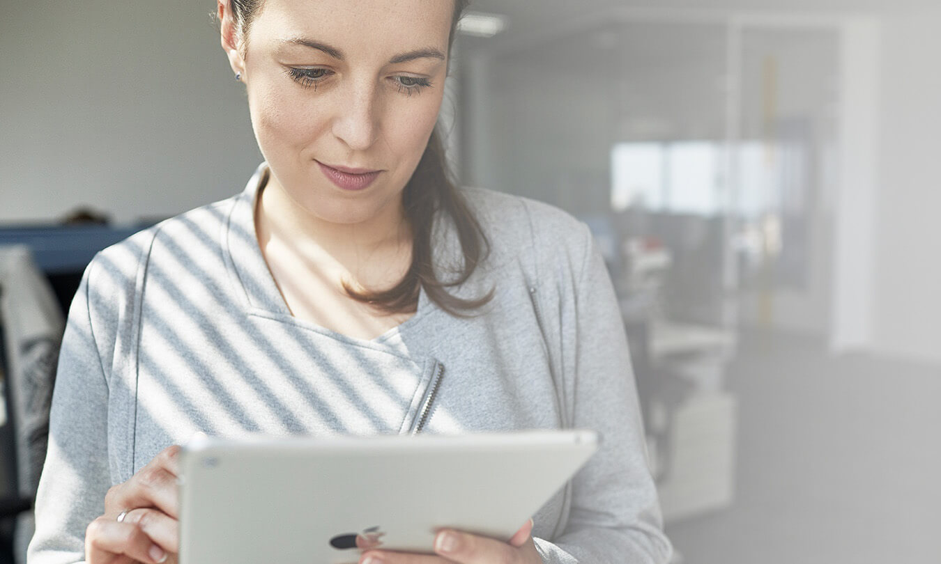 A person holding tablet computer.