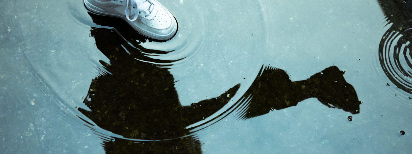 A close up image from a shoe in a water.