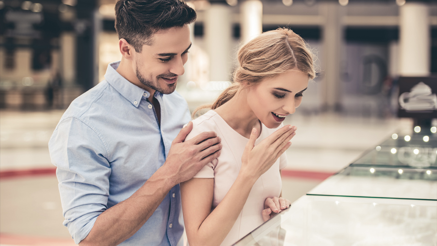 A couple looking at jewelry.