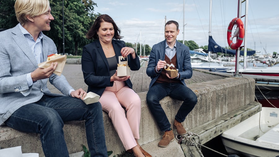 Colleagues enjoying outdoor picnic.