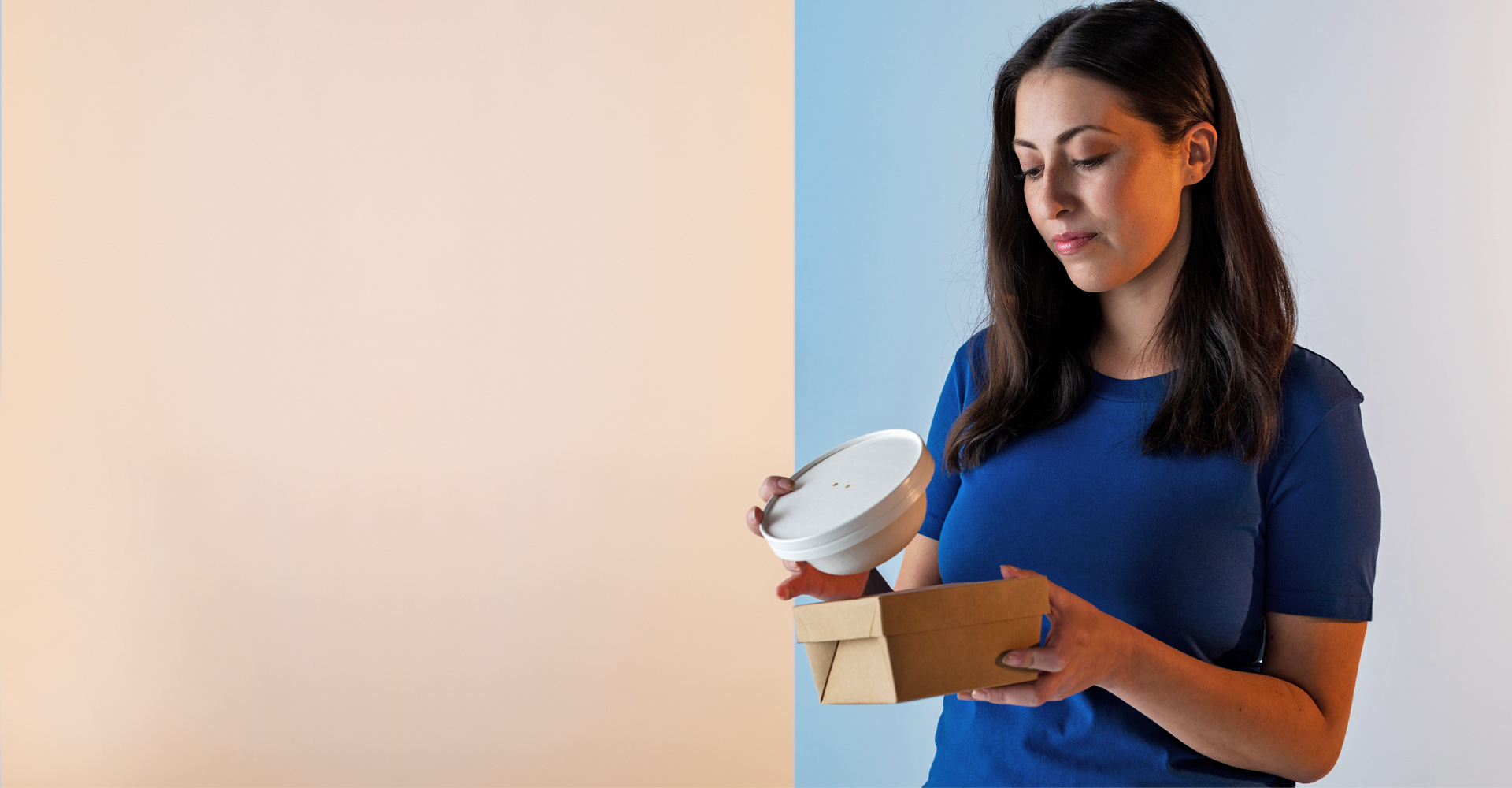 A person holding packaged food.