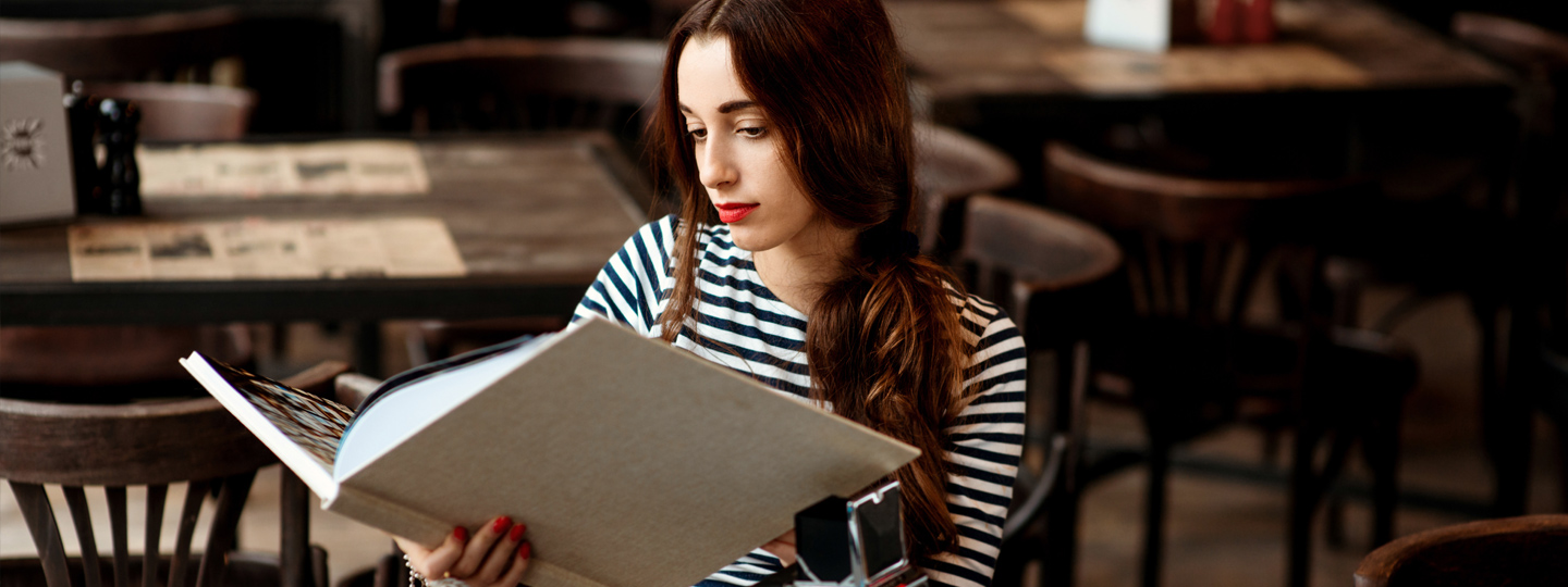 A person holding a book.