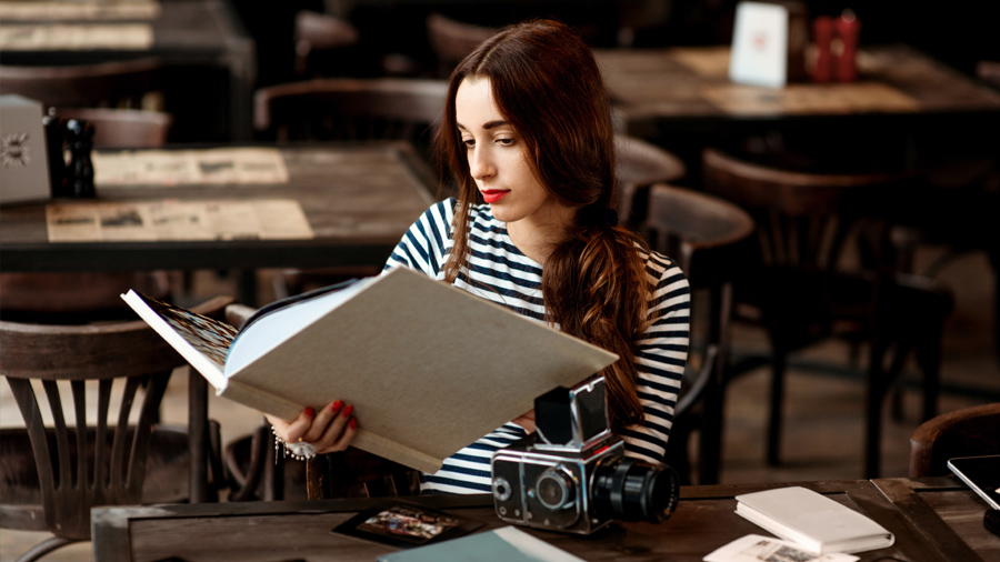 A person holding a book.