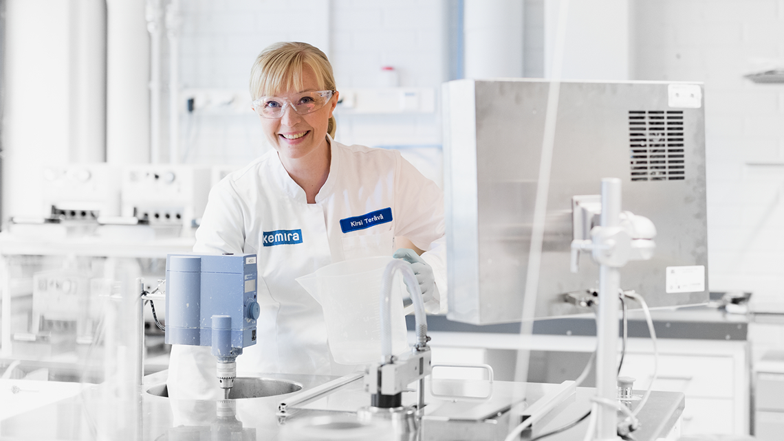 Female engineer working in Kemira research center.