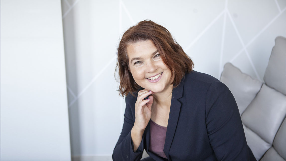 Mari Zabihian sitting in a meeting room