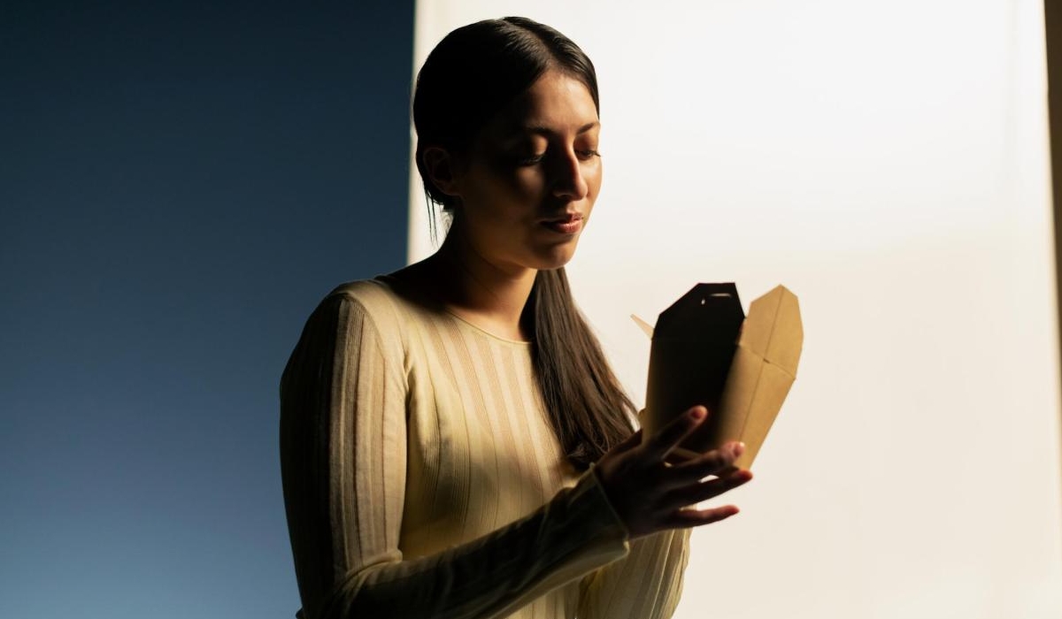 Woman holding takeaway package